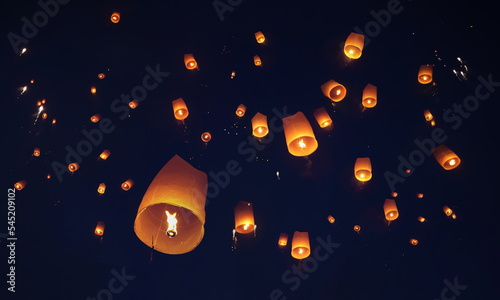 Release the traditional paper lanterns into the sky during the night of the festival in Thailand.
