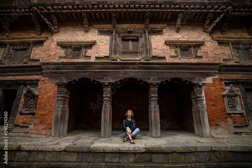 Female tourist at Patan Royal Palace Complex in Lalitpur, Nepal