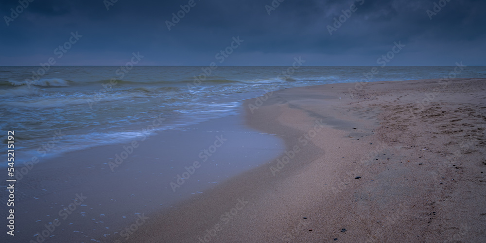 An autumn seascape waves and dark clouds