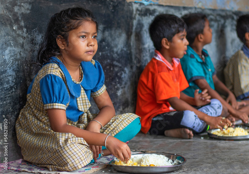 Student having mid day meal at school