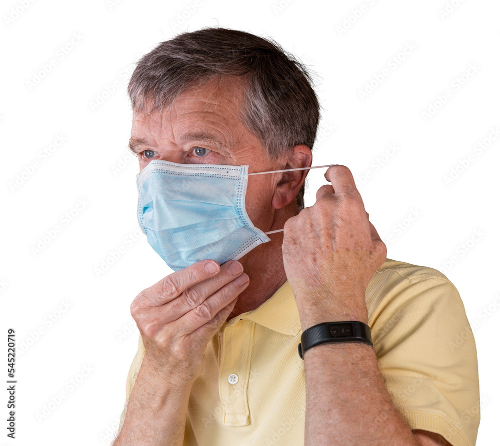 Senior man adjusting face mask and looking very worried about the epidemic Senior man adjusting face mask and looking very worried about the epidemic
