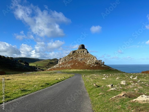 View of a waterside road and hills under the blue sky in Lynton and Lynmouth