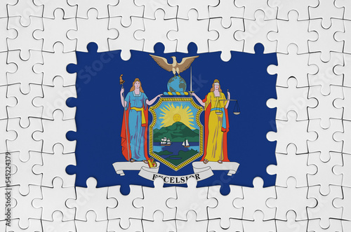 New York US state flag in frame of white puzzle pieces with missing central part photo