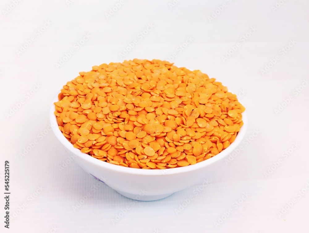 Split red lentils masoor daal dahl legume pulse dahal organic raw natural food dry daal-e-masoor masur ki dal source of protein in a bowl closeup view image stock photo Split red lentils masoor daal dahl legume pulse dahal organic raw natural food dry daal-e-masoor masur ki dal source of protein in a bowl closeup view image stock photo