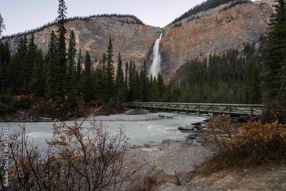 Beautiful shot of a waterfall flowing down between cliffs