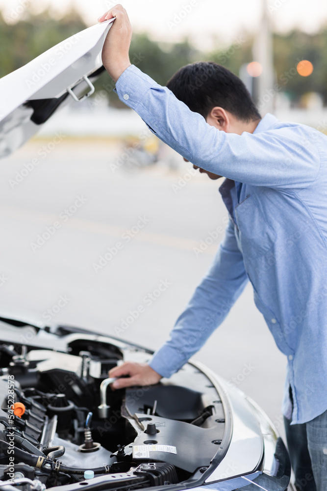 Man with checking car engine. Man with checking car engine.