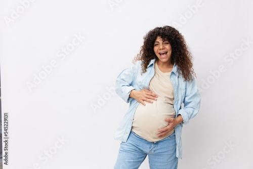 Pregnant woman's smile and the happiness of motherhood on a white isolated background