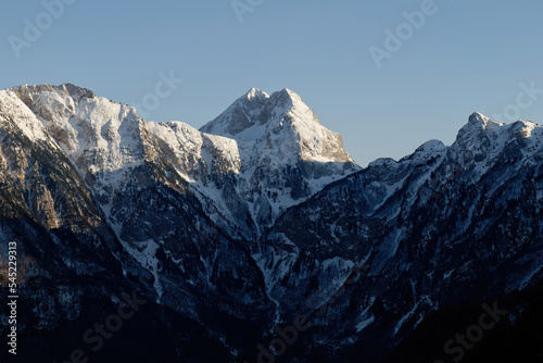 Amazing view of a mountain peak during sunset. Summit of difficult access for climbers. Alpinism and climbers. Blue sky and vibrant colors. Cinematic shot. More adventure in life. Prenj Mountain. 