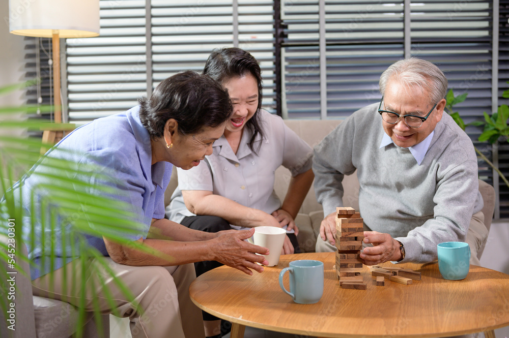 Group of elderly people enjoy talking , relaxing with game at senior healthcare center. Group of elderly people enjoy talking , relaxing with game at senior healthcare center.