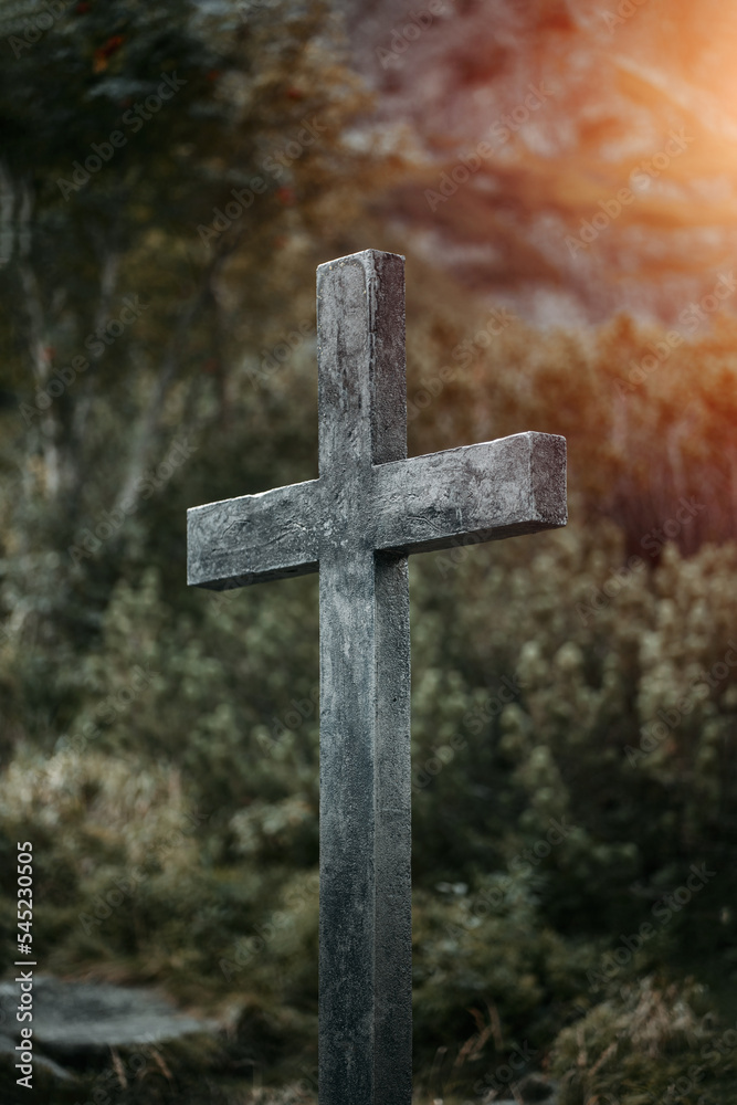 A wooden cross in the mountains on a tourist track.