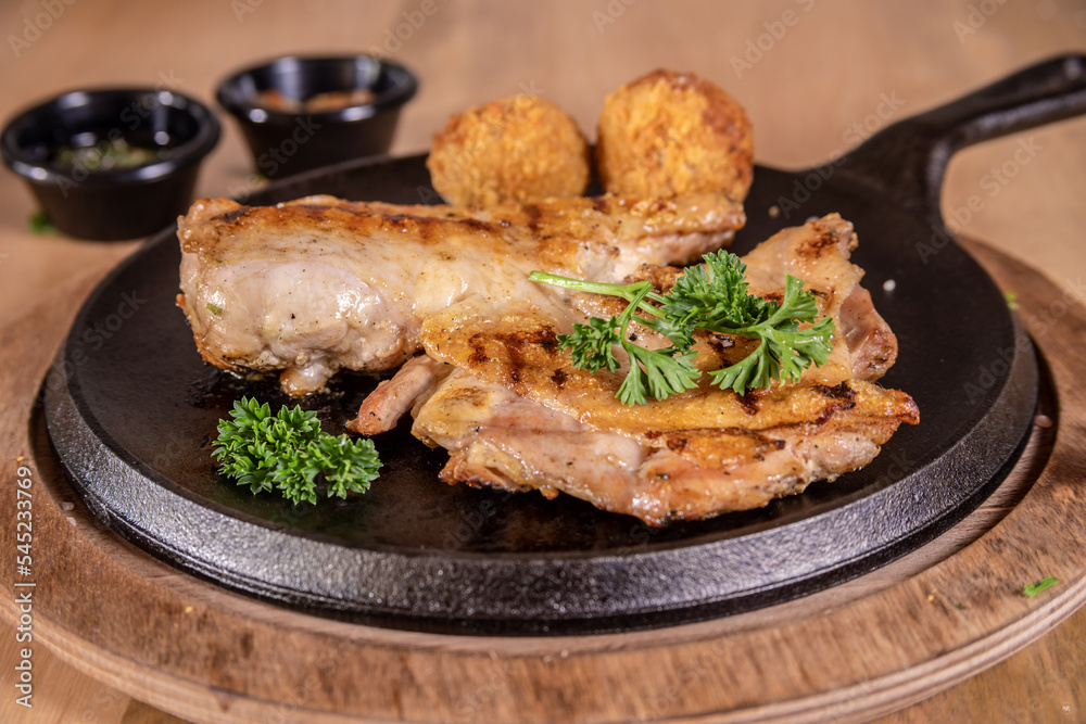 Typical colombian food and drinks, grilled chicken Typical colombian food and drinks, grilled chicken