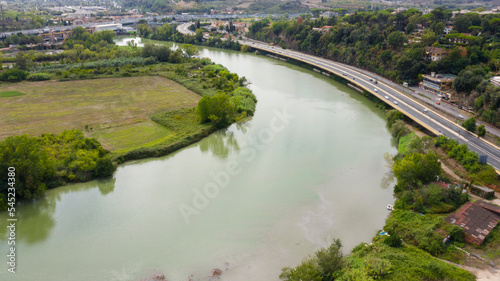 Aerial view of a bridge on the Via Tiberina in Rome  Italy. The road runs along the Tiber River.
