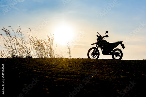 Fototapeta Naklejka Na Ścianę i Meble -  Motocross on a beautiful light mountain independent adventure tourism concept