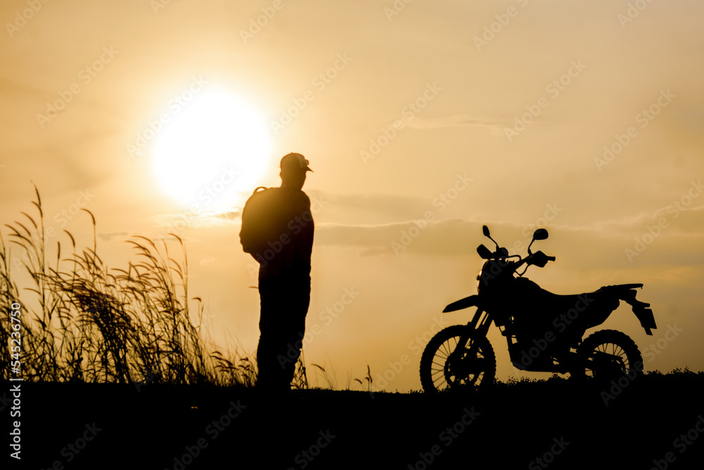 Blurred lens, motocross on a beautiful light mountain independent adventure tourism concept