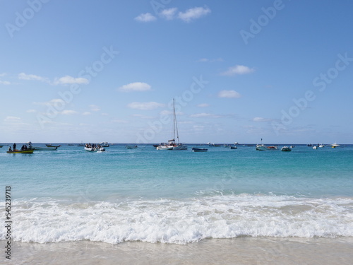 Boats and waves of Atlantic Ocean at Sal island in Cape Verde