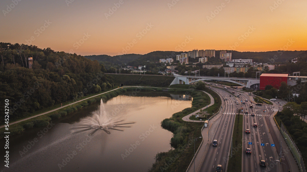 Drone view of the Niedźwiednik district, the PKM viaduct and the water reservoir at sunset.

