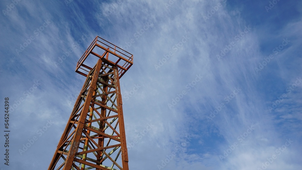 Low angle shot of tower of the Grand Old Lady of Miri city with blue cloudy sky