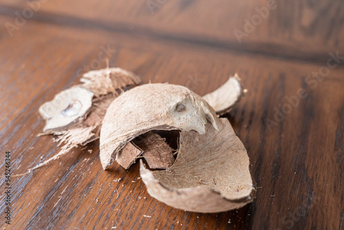 Cracked Coconut shell pieces on a table