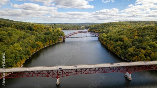 Drone shot of Taconic State Parkway over the New Croton Reservoir between greenery landscapes photo