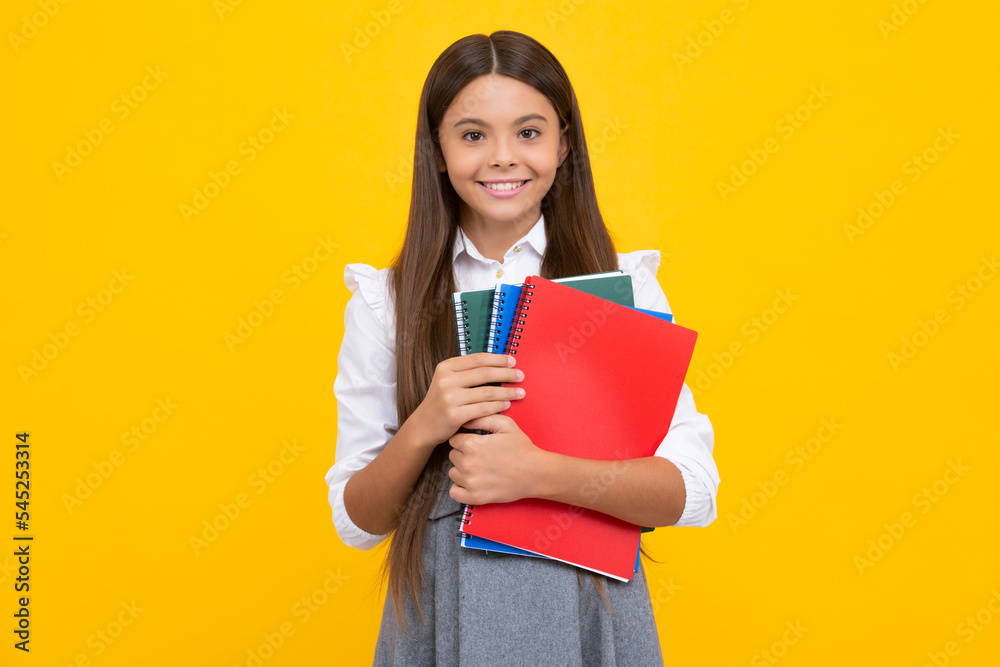 Teenager school girl with books isolated studio background. Happy girl face, positive and smiling emotions. Teenager school girl with books isolated studio background. Happy girl face, positive and smiling emotions.