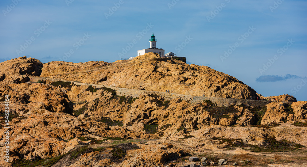 The old lighthouse on the rocky Pietra peninsula in the L'Ile-Rousse commune of France on Corsica, France