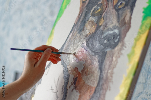 Woman drawing shepherd dog, animal art, oil paints