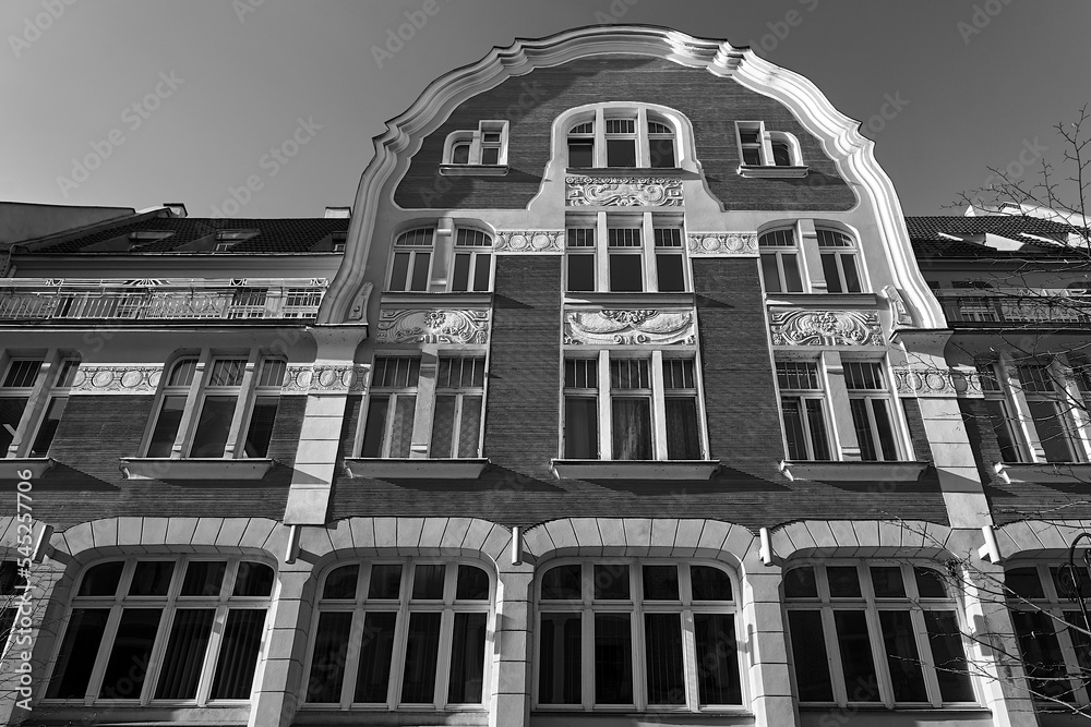 facade of a historic tenement house in the city of Poznan