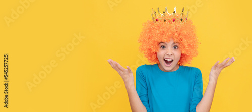 surprised selfish child girl in curly wig and princess diadem, surprise. Funny teenager child in wig, party poster. Banner header, copy space.