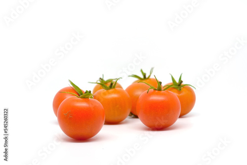 Fresh tomatoes isolated on white background...Cherry tomatoes on white background...Round red trellis tomatoes, also called vine tomato.