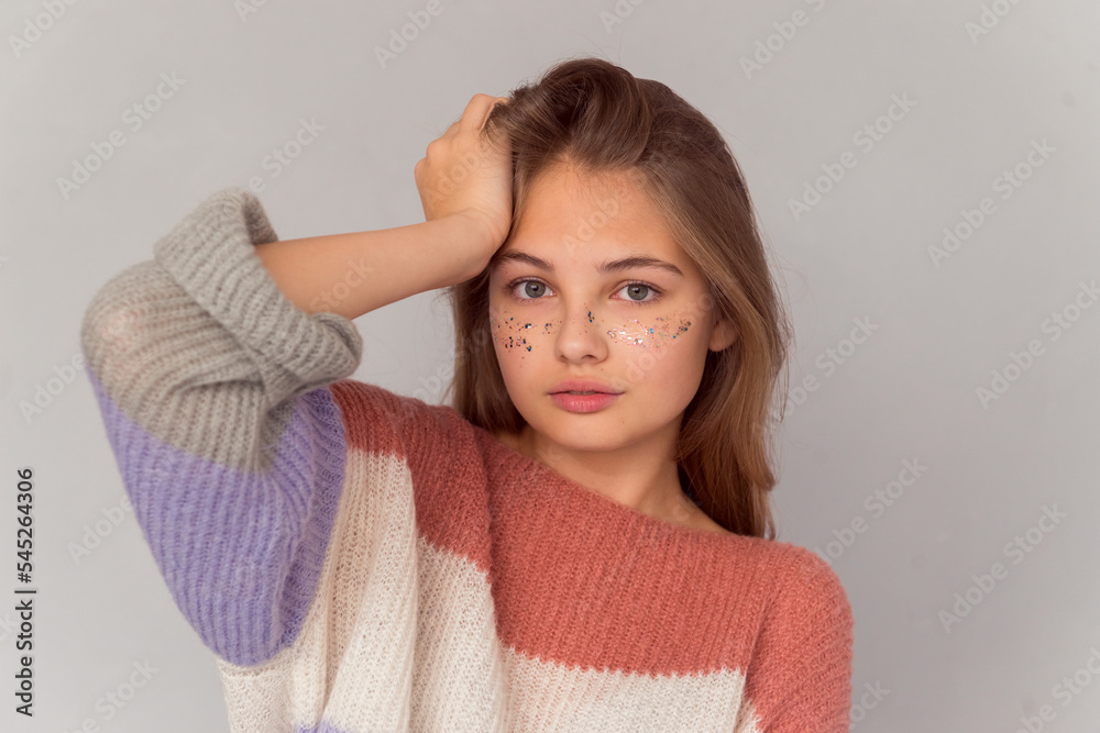 beautiful teen girl with shiny freckles portrait on grey background beautiful teen girl with shiny freckles portrait on grey background