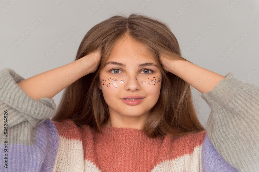 beautiful teen girl with shiny freckles portrait on grey background beautiful teen girl with shiny freckles portrait on grey background