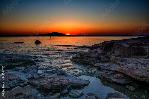 Beautiful colorful sunris at the sea with dramatic clouds and sun shining. Long Exposure of Soft and colorful sunset.