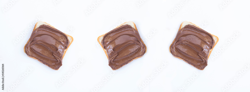 Chocolate cream bread on the white background. Copy space. Top view. Chocolate cream bread on the white background. Copy space. Top view.