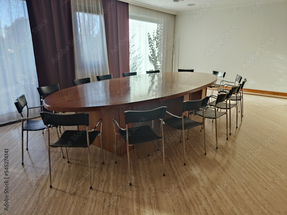 oval meeting table with chairs