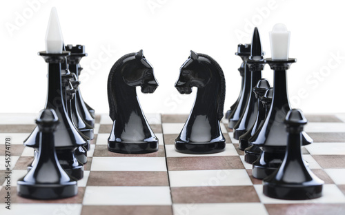 Wooden chess figures on a classic chessboard