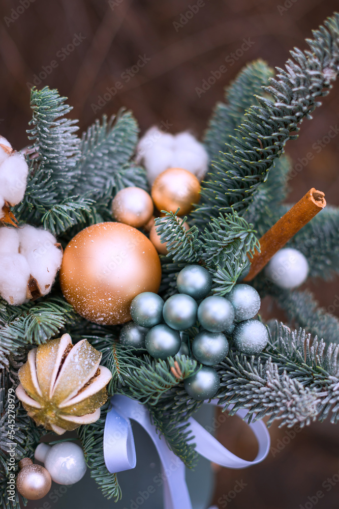 Christmas decoration with dry orange, balls and candle. New year decoration for cozy home