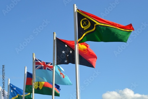 Flags of Pacific nations flying together with Fiji, Solomon Islands. Papua New Guinea and Vanuatu photo