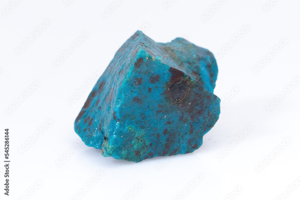 Natural Chrysocolla stone on a white background. Mineral of blue and bluish-green color on a white background Natural Chrysocolla stone on a white background. Mineral of blue and bluish-green color on a white background