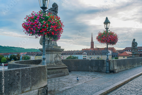 Gorgeous baskets with red ciolor flowers - as street decoration on Old main bridge