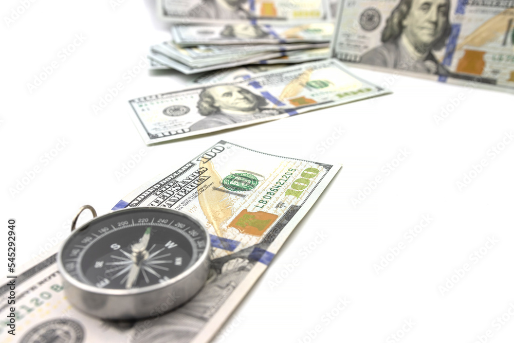 Navigational compass points to us money.