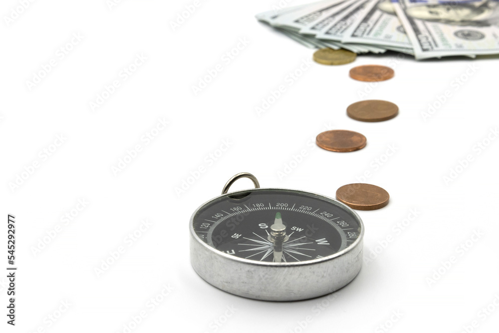 Navigational compass points to us money.