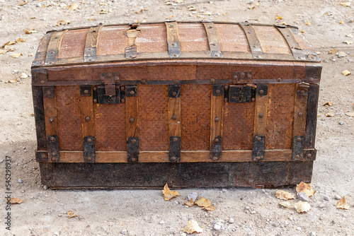 old wooden travel trunk deteriorated by the passage of time. antique restoration and travels