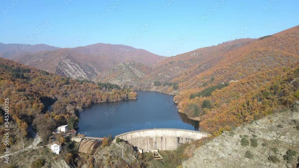 Aerial panoramic view of concrete Dam at reservoir with flowing water, hydroelectricity power station Aerial panoramic view of concrete Dam at reservoir with flowing water, hydroelectricity power station