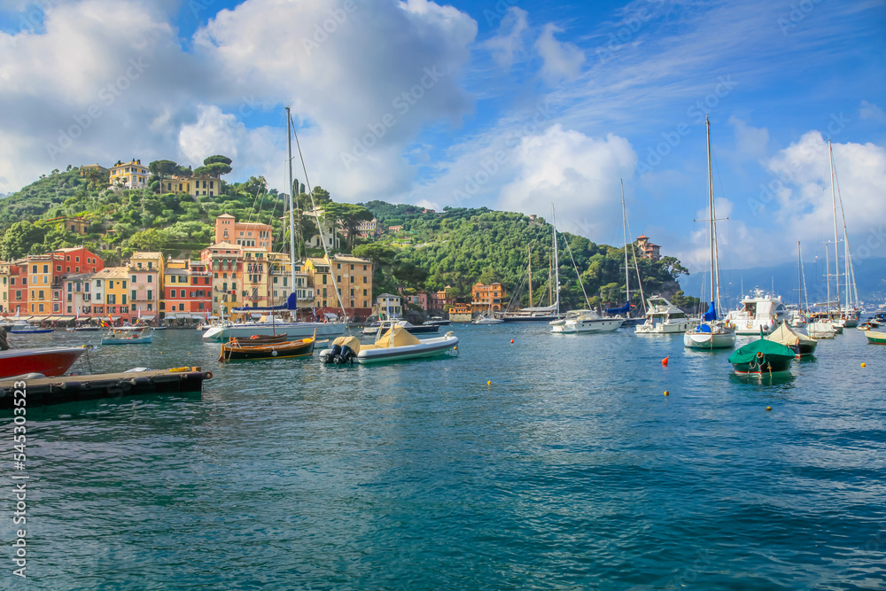 Portofino with houses, luxury boats and yacht, bay harbor. Liguria, Italy
