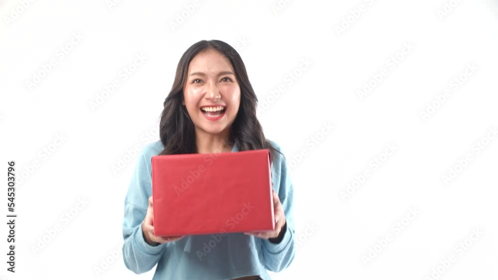 Pleasant surprise asian young woman receive celebration or birthday or anniversary red gift box form boyfriend on white background. Excited joyful girl receive wishing care gift copy space. Lifestyle Pleasant surprise asian young woman receive celebration or birthday or anniversary red gift box form boyfriend on white background. Excited joyful girl receive wishing care gift copy space. Lifestyle