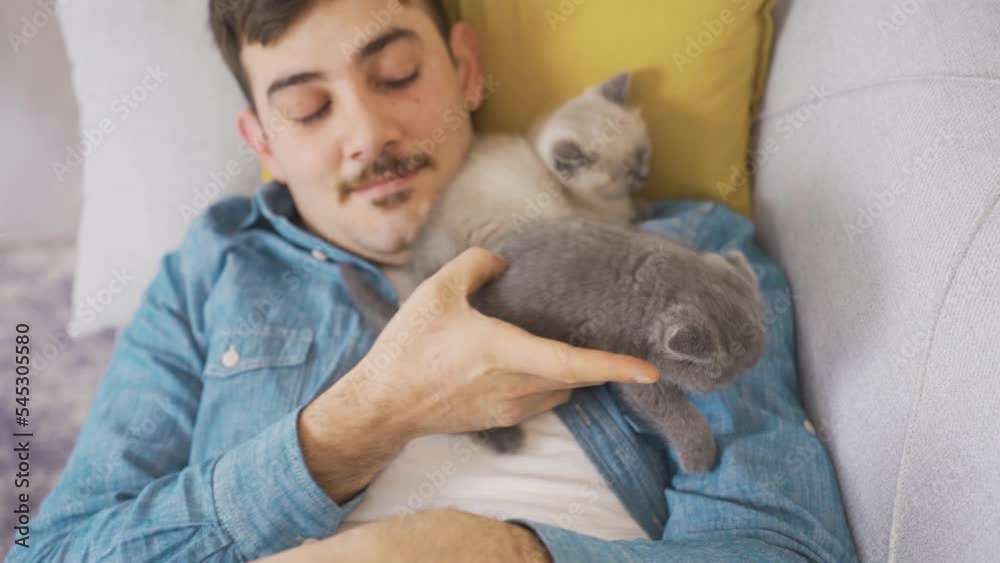 The man sleeps with his cats.
Man sleeping with cute Scottish Fold kittens is happy.
The man sleeps with his cats.
Man sleeping with cute Scottish Fold kittens is happy.
