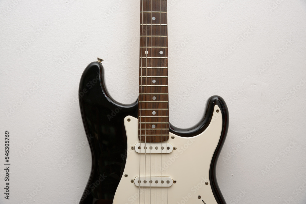 Fototapeta premium black and white electric guitar close up