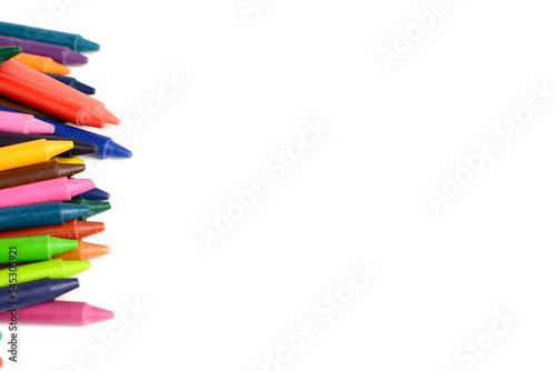 Crayons lined up isolated on white background.