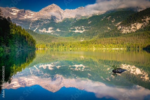 Fototapeta Naklejka Na Ścianę i Meble -  Lake Tovel reflection symmetry in Trentino-Alto Adige, Dolomites, Italy