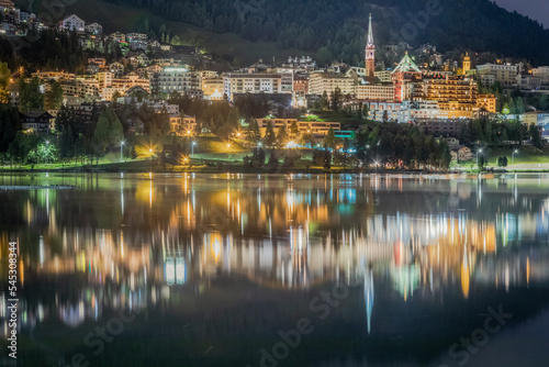 St Moritz cityscape and lake reflection at night, Engadine, Swiss alps